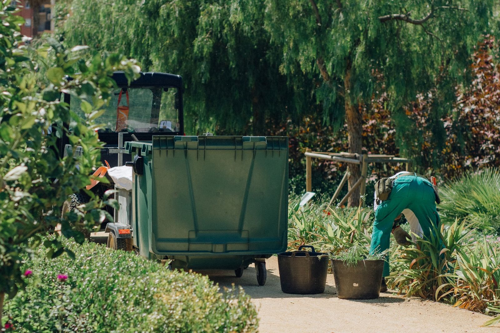 Farm equipment and tools beside a farmer leaning over